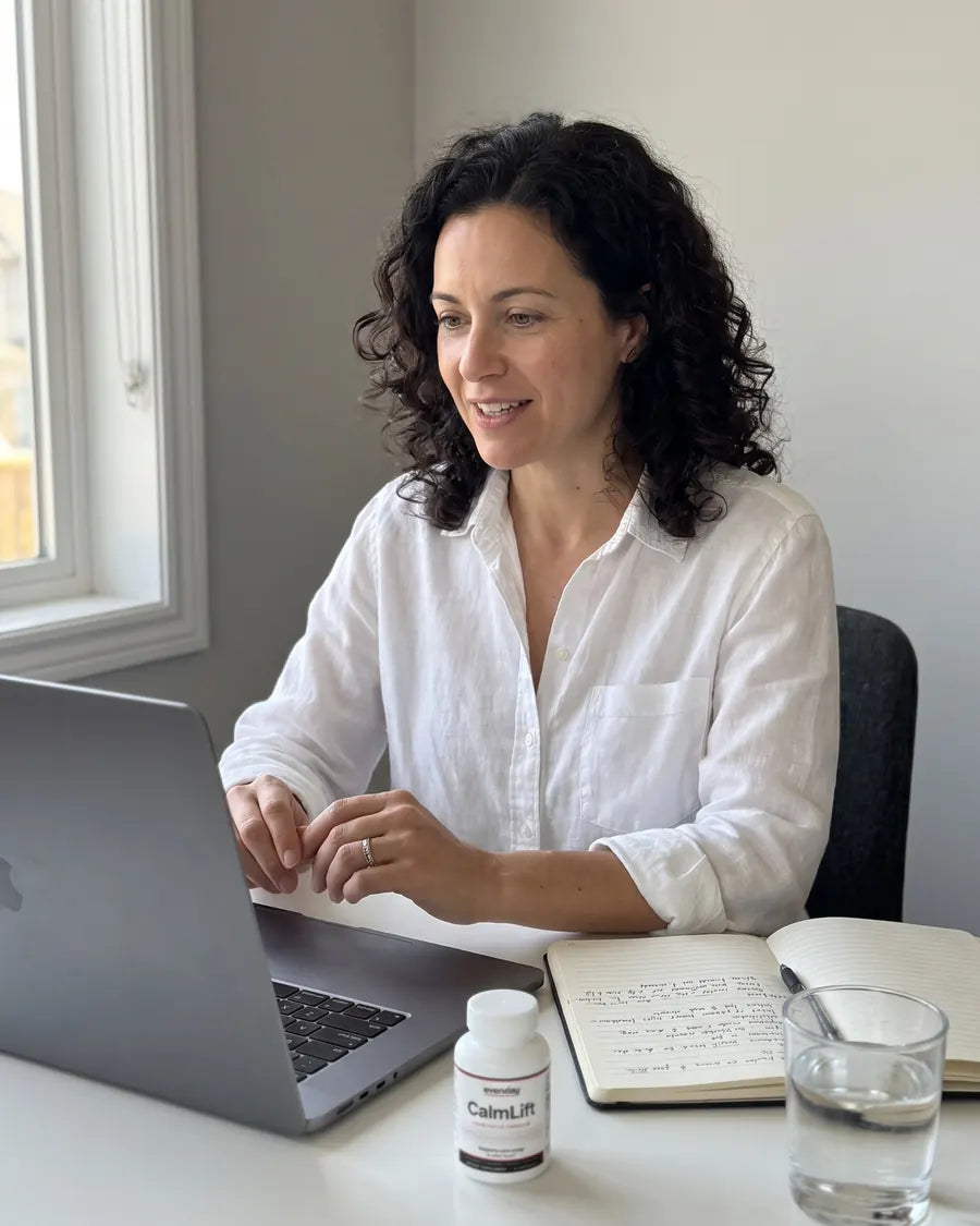 A woman on a video call at 4pm, calm and engaged, CalmLift on her desk